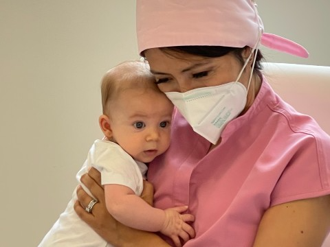 Dr. Patty holding baby